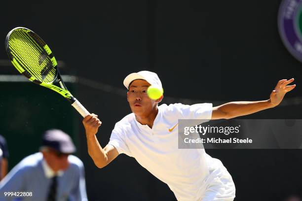 Chun Hsin Tseng of Taiwan returns against Jack Draper of Great Britain during the Boys' Singles final on day thirteen of the Wimbledon Lawn Tennis...