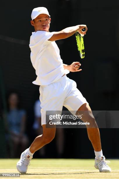 Chun Hsin Tseng of Taiwan returns against Jack Draper of Great Britain during the Boys' Singles final on day thirteen of the Wimbledon Lawn Tennis...