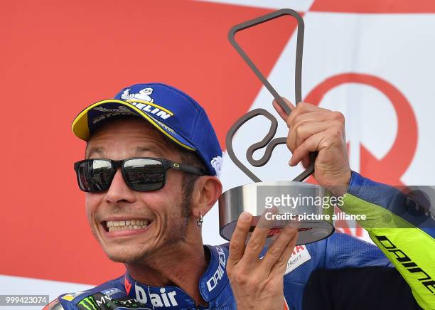 July 2017, Germany, Hohenstein-Ernstthal: German motorcycle Grand Prix, MotoGP at the Sachsenring: Valentino Rossi celebrates his 2nd place on the...
