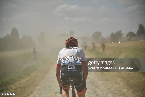 Netherlands' Koen de Kort pedals through a cobblestone section during the ninth stage of the 105th edition of the Tour de France cycling race between...