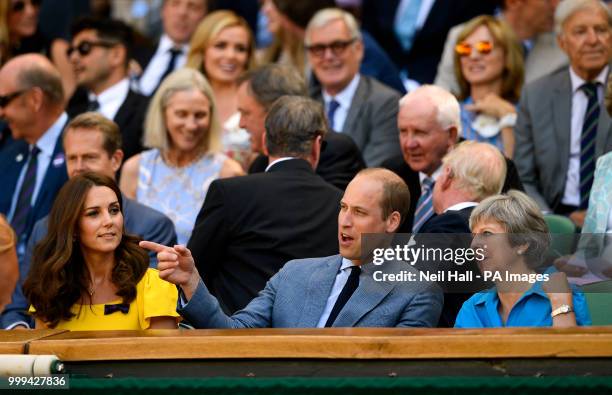 The Duke and Duchess of Cambridge and Theresa May in the royal box on centre court on day thirteen of the Wimbledon Championships at the All England...