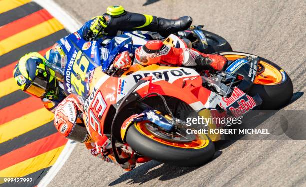 Spanish Honda rider Marc Marquez competes ahead of Italian Yamaha rider Valentino Rossi during the Moto GP race at the Grand Prix of Germany at the...