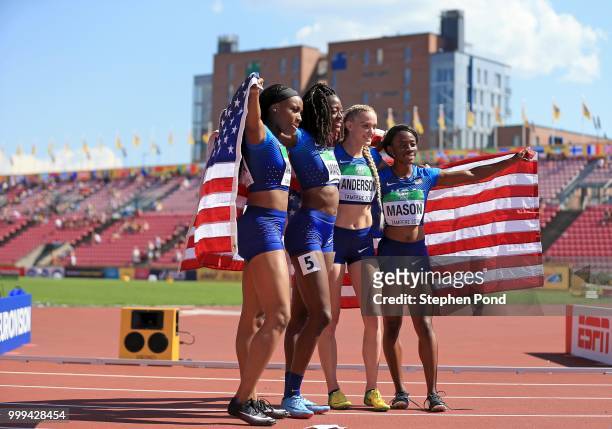 Symone Mason, Shae Anderson, Julia Madubuike and Taylor Manson of The USA celebrate winning gold in the final of the women's 4x400m relay on day six...