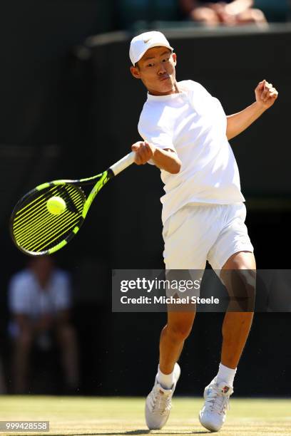 Chun Hsin Tseng of Taiwan returns against Jack Draper of Great Britain during the Boys' Singles final on day thirteen of the Wimbledon Lawn Tennis...