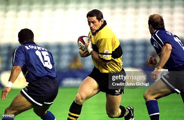 Rory Jenkins of Wasps is challanged by Jason Robinson and Fraser Walters of Sale during the Zurich Premiership match between London Wasps and the...