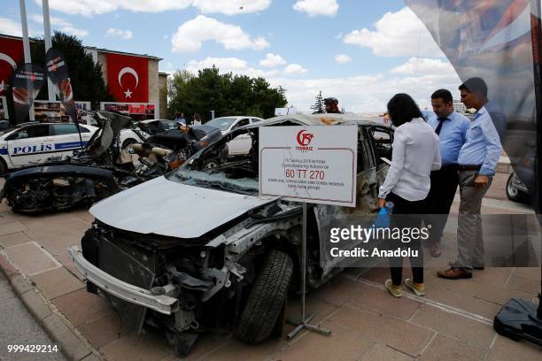 Vehicles damaged by tanks on July 15 defeated coup are displayed at garden of Grand National Assembly of Turkey within the July 15 Democracy and...