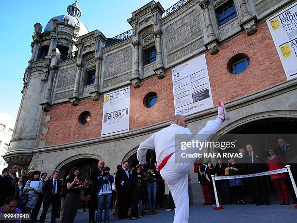 Dancer performs in front of French architect Philippe Starck and Mayor of Bilbao Inaki Azkuna during the inauguration of the new cultural center the...