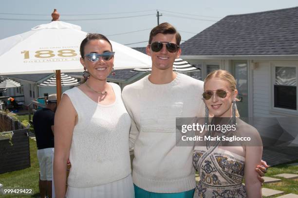 Madeline Howell and Sam Moorkamp attend the Modern Luxury + The Next Wave at Breakers Montauk on July 14, 2018 in Montauk, New York.