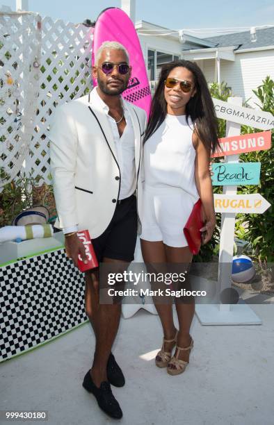 Luis Braga and English Berthoumieux attend the Modern Luxury + The Next Wave at Breakers Montauk on July 14, 2018 in Montauk, New York.
