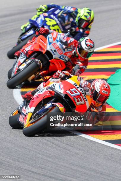 July 2017, Germany, Hohenstein-Ernstthal: German motorcycle Grand Prix, MotoGP at the Sachsenring: Marc Marquez leads ahead of Jorge Lorenzo and...