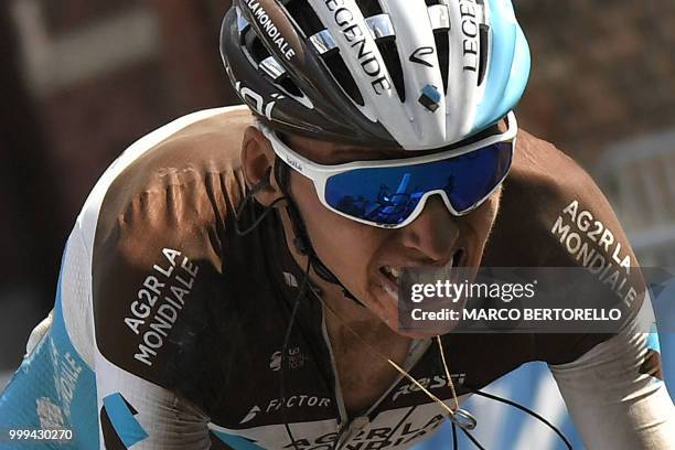 France's Romain Bardet rides after suffering a third puncture during the ninth stage of the 105th edition of the Tour de France cycling race between...