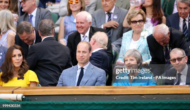 The Duke and Duchess of Cambridge and Theresa and Philip May in the royal box on centre court on day thirteen of the Wimbledon Championships at the...