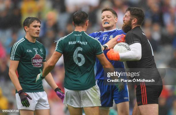 Dublin , Ireland - 15 July 2018; Kildare players, from left, David Hyland, Eoin Doyle and Mark Donnellan tussle with Conor McManus of Monaghan during...