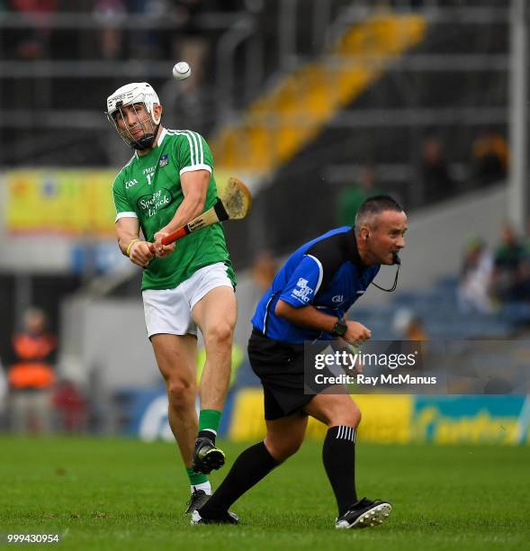 Thurles , Ireland - 15 July 2018; Referee James McGrath ducks as Aaron Gillane of Limerick fires in a shot during the GAA Hurling All-Ireland Senior...