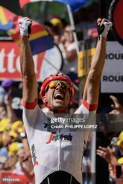 Germany's John Degenkolb celebrates as he crosses the finish line to win the ninth stage of the 105th edition of the Tour de France cycling race...