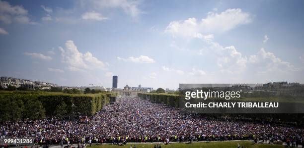 France supporters gather on the fan zone to watch the Russia 2018 World Cup final football match between France and Croatia, on the Champ de Mars in...