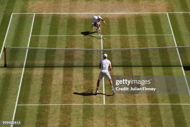 Novak Djokovic of Serbia attempts to return against Kevin Anderson of South Africa during the Men's Singles final on day thirteen of the Wimbledon...