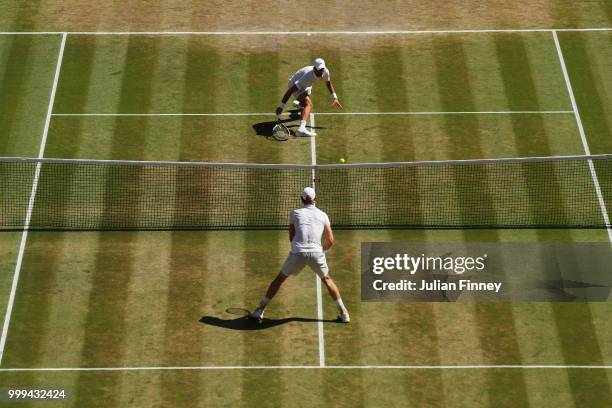 Novak Djokovic of Serbia returns against Kevin Anderson of South Africa during the Men's Singles final on day thirteen of the Wimbledon Lawn Tennis...