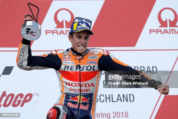 Marc Marquez of Spain and Repsol Honda Team celebrates winning the MotoGP of Germany at Sachsenring Circuit on July 15, 2018 in Hohenstein-Ernstthal,...