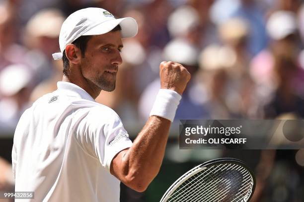 Serbia's Novak Djokovic celebrates winning the second set against South Africa's Kevin Anderson in their men's singles final match on the thirteenth...