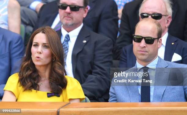 Catherine, Duchess of Cambridge and Prince William, Duke of Cambridge reacts as they attend the men's singles final on day thirteen of the Wimbledon...
