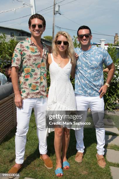 Eric Goldie and Dria Murphy attend the Modern Luxury + The Next Wave at Breakers Montauk on July 14, 2018 in Montauk, New York.