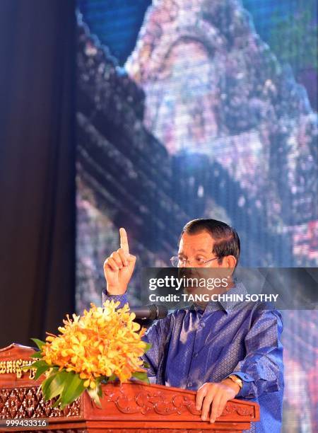 Cambodian Prime Minister Hun Sen speaks during a ceremony at the Olympic national stadium in Phnom Penh on July 15, 2018. - The Cambodian government...