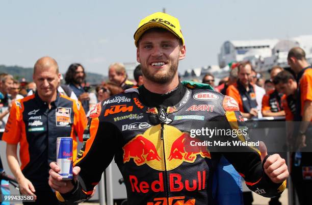 Brad Binder of South Africa and Red Bull KTM Team celebrates winning the Moto2 race during at the Sachsenring Circuit on July 15, 2018 in...
