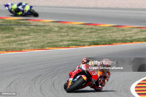 July 2017, Germany, Hohenstein-Ernstthal: German motorcycle Grand Prix, MotoGP at the Sachsenring: Marc Marquez leads ahead of Valentino Rossi ....
