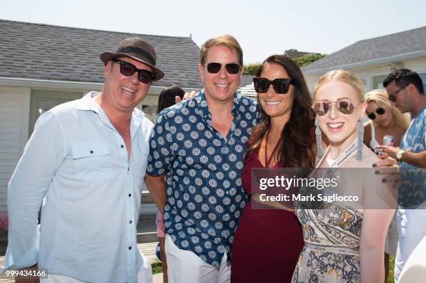 Salvatore Piazzolla, Grant Wilfley, Publisher Lynn Scotti and Sydney Sadick attend the Modern Luxury + The Next Wave at Breakers Montauk on July 14,...