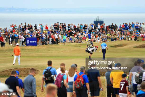 Rickie Fowler of USA and Russell Knox of Scotland walk down the fairway of hole two during day four of the Aberdeen Standard Investments Scottish...