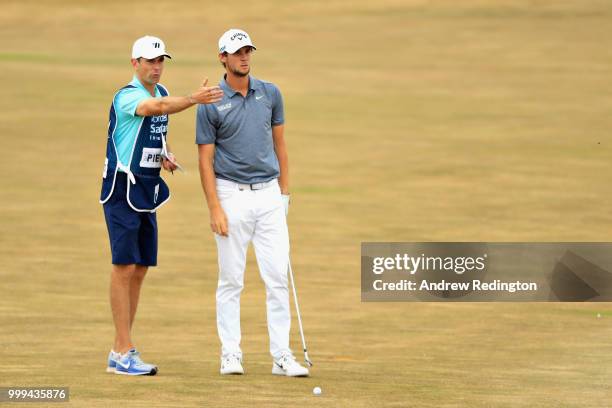 Thomas Pieters of Belgium talks with his caddy Adam Marrow on hole four during day four of the Aberdeen Standard Investments Scottish Open at Gullane...