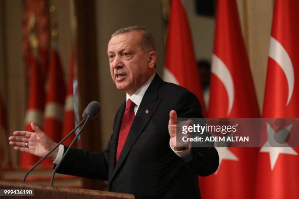 Turkish President Tayyip Erdogan delivers a speech during a ceremony marking the second anniversary of the attempted coup at the Presidential Palace...
