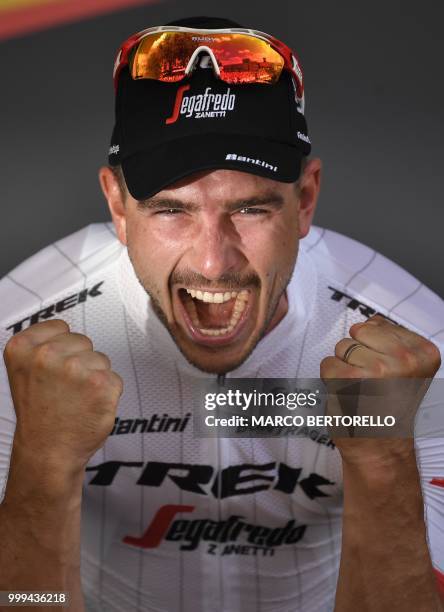 Germany's John Degenkolb celebrates on the podium after winning the ninth stage of the 105th edition of the Tour de France cycling race between Arras...