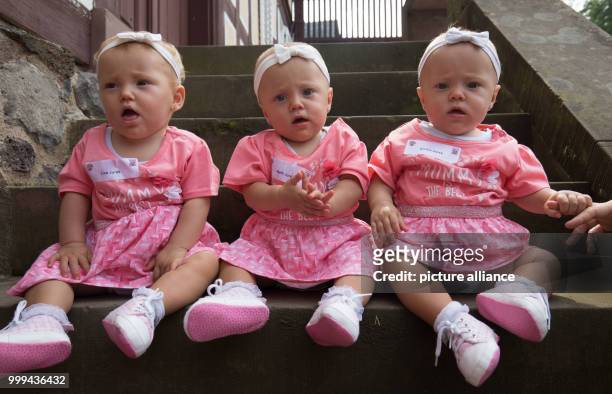 The triplets Lisa , Nelly and Emilia from Hochheim pose for a photo at the traditional triplet meeting of the Hessian Prime Minister at the open air...