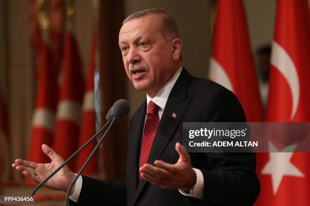 Turkish President Tayyip Erdogan delivers a speech during a ceremony marking the second anniversary of the attempted coup at the Presidential Palace...