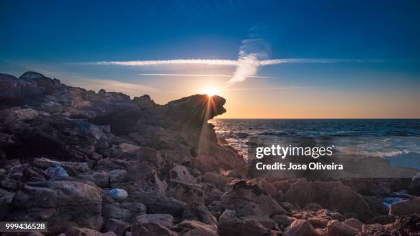 scattered rocks by the sea - oliveira stock pictures, royalty-free photos & images
