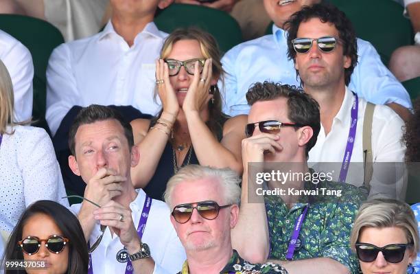 Kate Winslet reacts as Ned Rocknroll looks on during the men's singles final on day thirteen of the Wimbledon Tennis Championships at the All England...