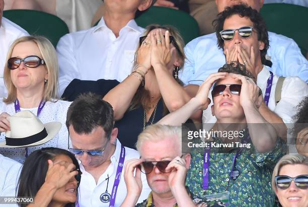 Kate Winslet and Ned Rocknroll react during the men's singles final on day thirteen of the Wimbledon Tennis Championships at the All England Lawn...