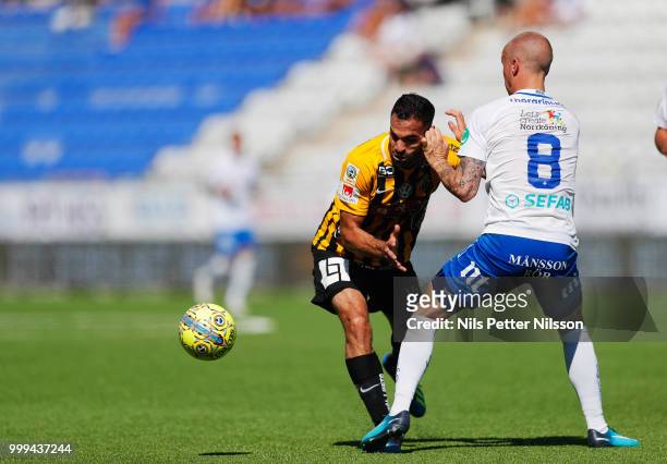 Mervan Celik of BK Hacken and Gudmundur Thorarinsson of IFK Norrkoping competes for the ball during the Allsvenskan match between IFK Norrkoping and...