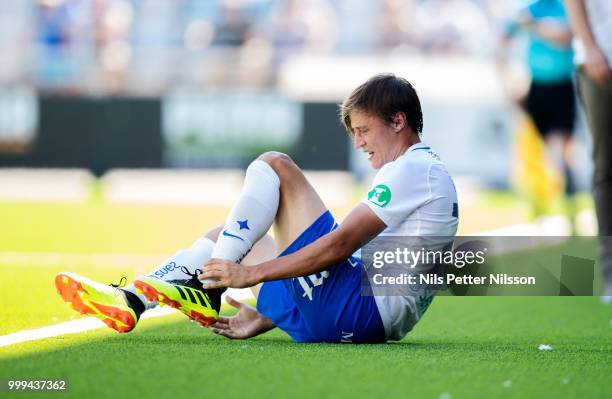 Simon Thern of IFK Norrkoping in pain during the Allsvenskan match between IFK Norrkoping and BK Hacken at Ostgotaporten on July 15, 2018 in...