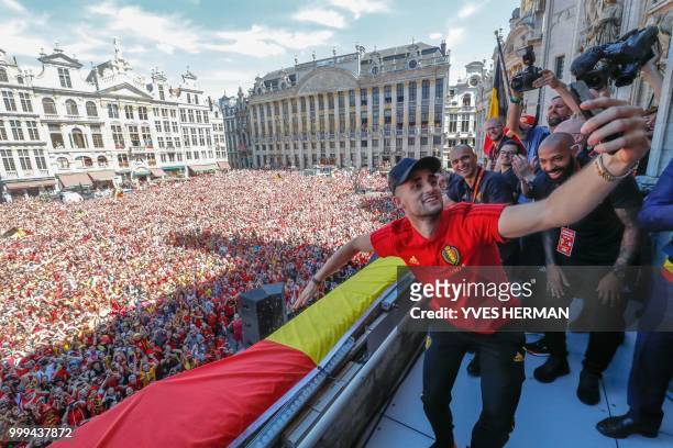Belgium's Adnan Januzaj, Belgium's head coach Roberto Martinez and Belgium's assistant coach Thierry Henry celebrate on the balcony in front of more...