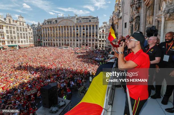 Belgium's captain Eden Hazard celebrates on the balcony in front of more than 8000 supporters at the Grand Place/Grote Markt in Brussels city center,...