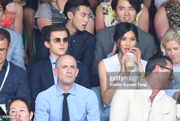 Tom Holland and Gemma Chan attend the men's singles final on day thirteen of the Wimbledon Tennis Championships at the All England Lawn Tennis and...