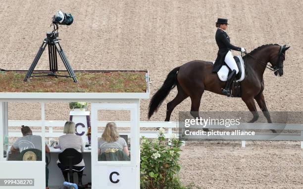 German dressage rider Dorothee Schneider and horse Sammy Davis in action during the freestyle dressage grand prix of the FEI European Championships...