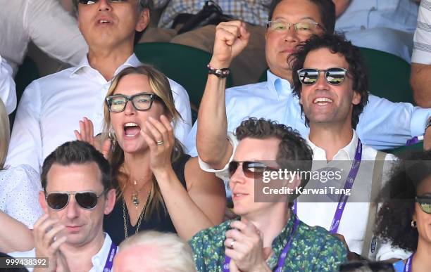 Kate Winslet and Ned Rocknroll react during the men's singles final on day thirteen of the Wimbledon Tennis Championships at the All England Lawn...