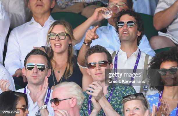 Kate Winslet and Ned Rocknroll react during the men's singles final on day thirteen of the Wimbledon Tennis Championships at the All England Lawn...