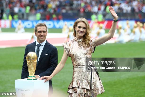 Former Germany international Phillip Lahm and Natalia Vodianova present the trophy before the FIFA World Cup 2018 final at the Luzhniki Stadium in...