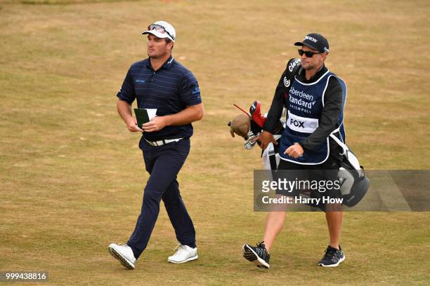 Ryan Fox of New Zealand walks with his caddy on the fairway of hole one during day four of the Aberdeen Standard Investments Scottish Open at Gullane...