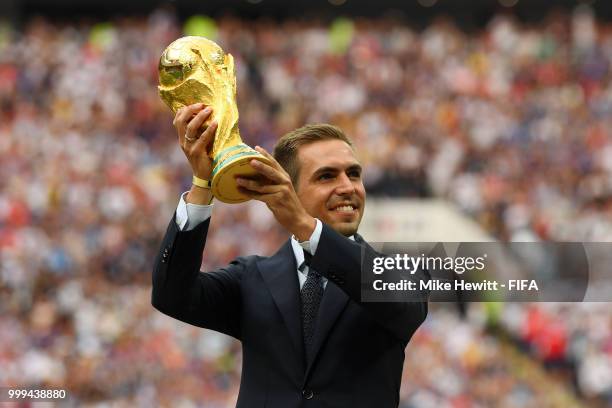 Former German International Footballer, Philipp Lahm presents the 2018 FIFA World Cup Original Trophy ahead of the 2018 FIFA World Cup Final between...